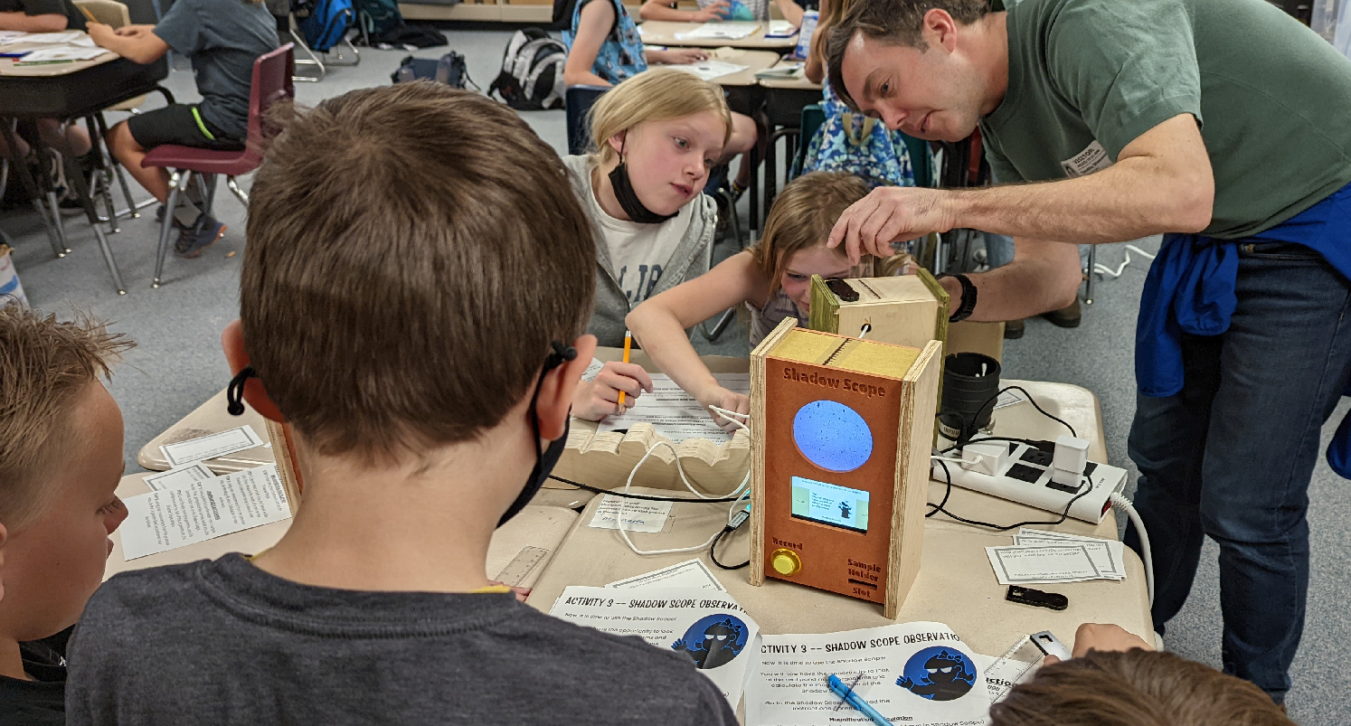 Tim showing Bennett Elementary students how to use the Shadow Scope