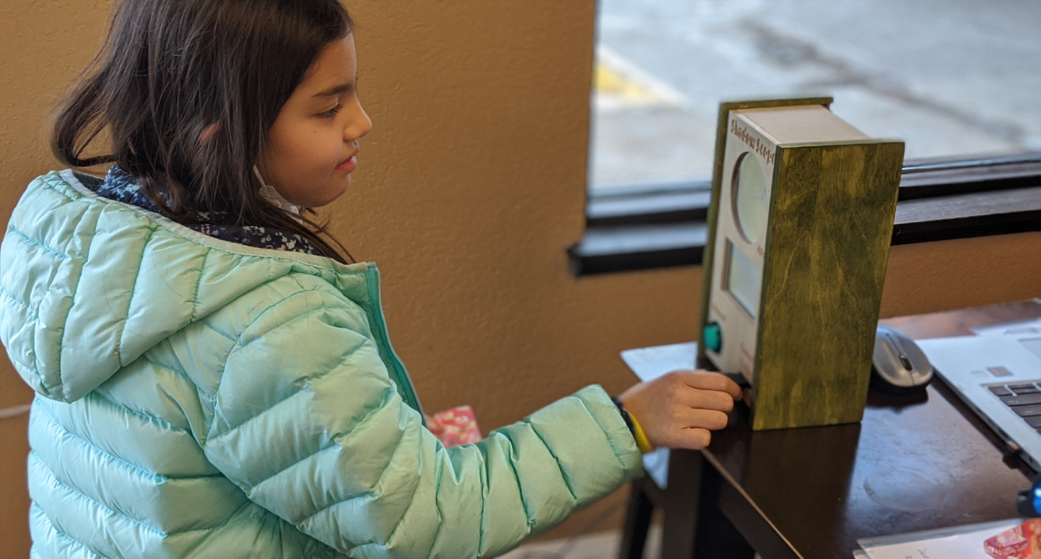 girl looking at shadow scope