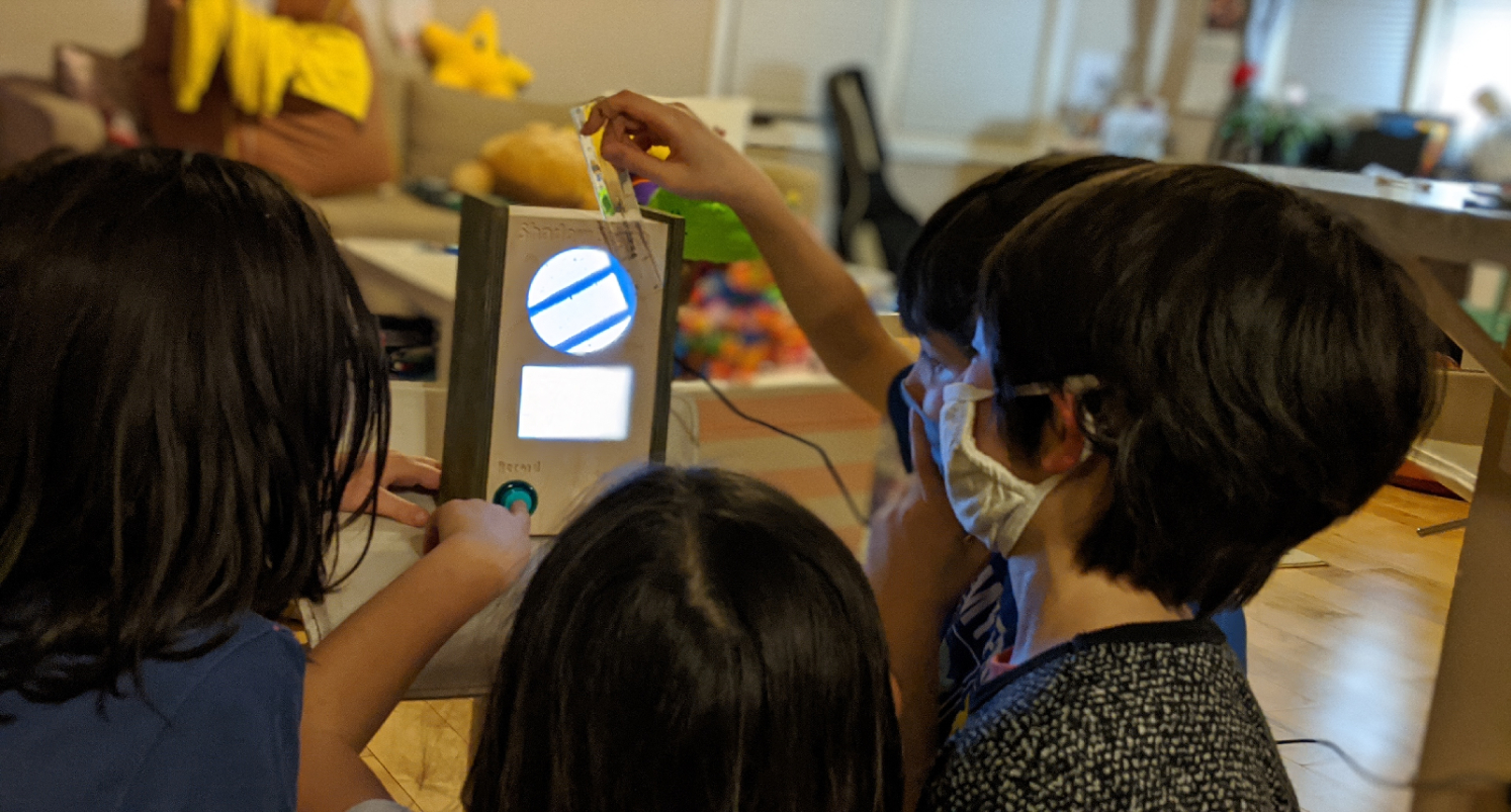 bunch of kids looking at shadow scope and measuring